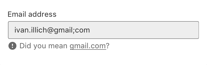 Screenshot of input field in an error state which is difficult to notice; grey border, light grey background, grey error text with icon below.